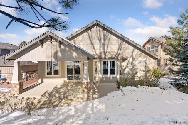 view of snow covered house