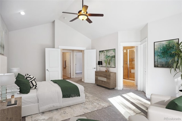 bedroom with ensuite bathroom, ceiling fan, light carpet, and high vaulted ceiling