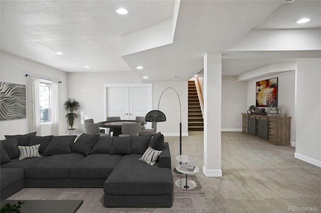 carpeted living room with a textured ceiling