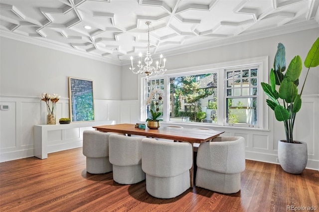 dining room with wood-type flooring, beamed ceiling, coffered ceiling, an inviting chandelier, and crown molding