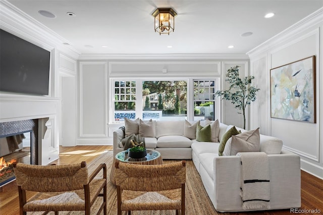 living room with ornamental molding and dark hardwood / wood-style floors