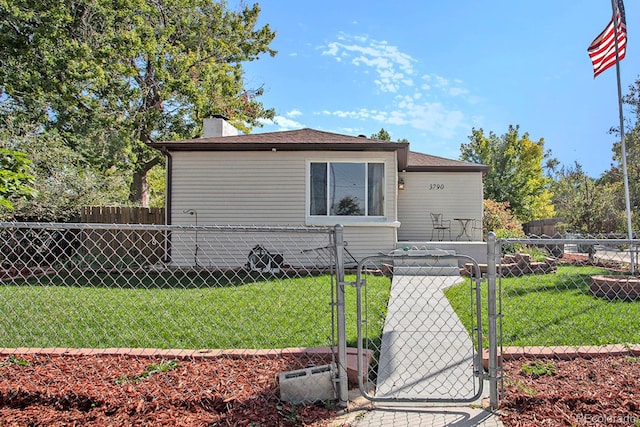 bungalow-style home featuring a gate, a chimney, a front lawn, and fence