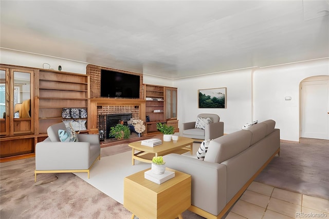 tiled living room featuring a fireplace