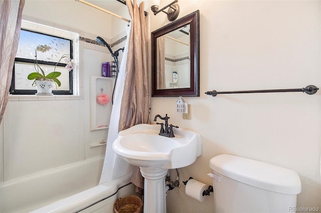 bathroom with toilet and shower / tub combo with curtain