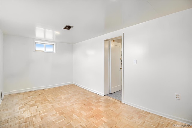 unfurnished room with light parquet floors