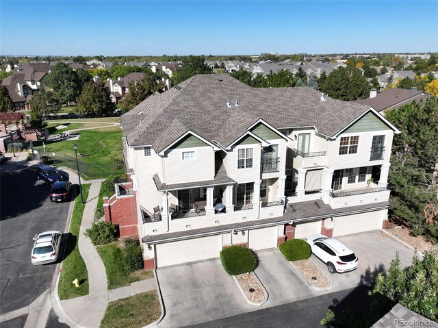 birds eye view of property with a residential view