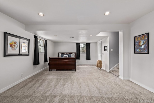 bedroom featuring baseboards, carpet floors, and recessed lighting
