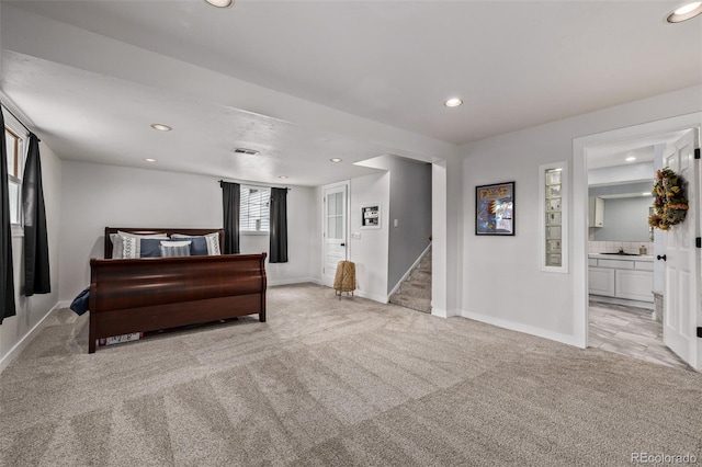 bedroom with baseboards, light carpet, and recessed lighting
