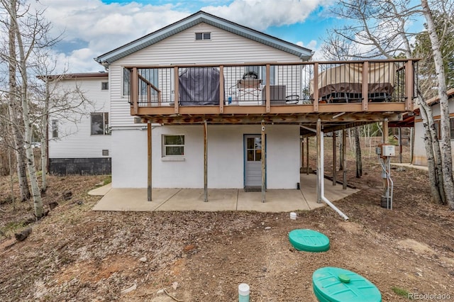 rear view of property with a patio area and a deck