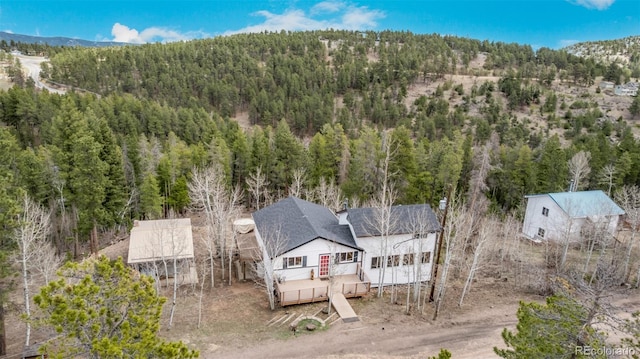 aerial view with a forest view and a mountain view