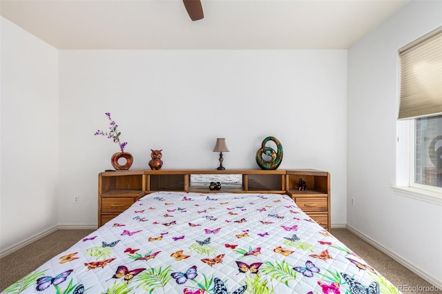 bedroom featuring dark carpet and ceiling fan