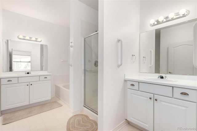 bathroom with vanity and separate shower and tub