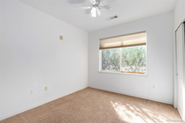 unfurnished room featuring carpet flooring and ceiling fan