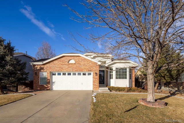 single story home featuring a garage and a front lawn