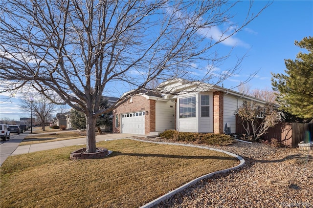 ranch-style home with a garage and a front lawn