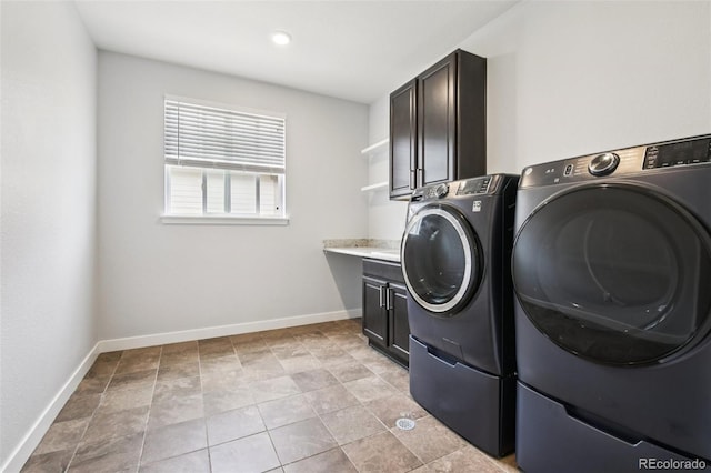 27196 E Alder Dr, Aurora, CO 80016 - washroom featuring washer and clothes dryer and cabinet space