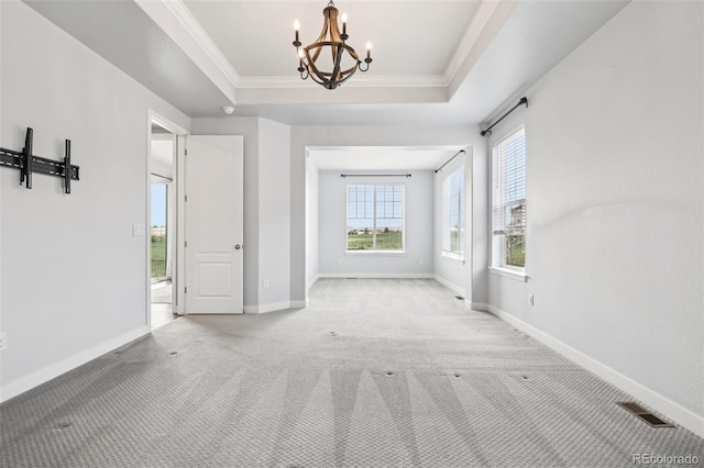 27196 E Alder Dr, Aurora, CO 80016 - unfurnished room with carpet flooring, a chandelier, crown molding, and a raised ceiling