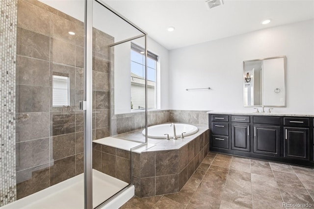 27196 E Alder Dr, Aurora, CO 80016 - bathroom featuring vanity, a bath, and a shower stall