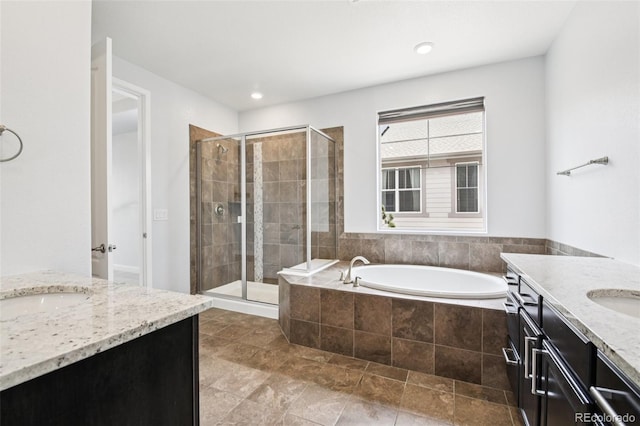 27196 E Alder Dr, Aurora, CO 80016 - full bath with two vanities, a stall shower, and a bath