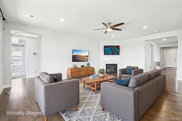 27196 E Alder Dr, Aurora, CO 80016 - living area with a ceiling fan, wood finished floors, recessed lighting, and a glass covered fireplace