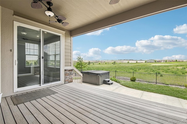 27196 E Alder Dr, Aurora, CO 80016 - wooden terrace with a hot tub, a ceiling fan, a fenced backyard, and a rural view