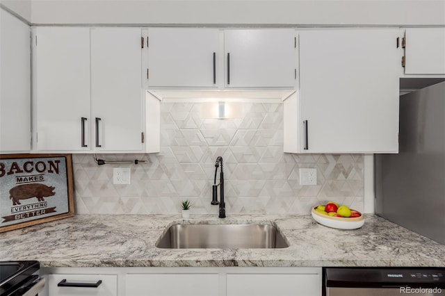2620 S Federal Blvd Unit K, Denver, CO 80219 - kitchen with dishwasher, white cabinets, and tasteful backsplash