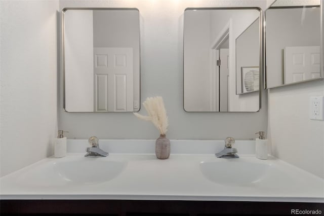 2620 S Federal Blvd Unit K, Denver, CO 80219 - bathroom featuring double vanity