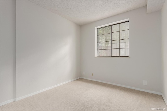 2620 S Federal Blvd Unit K, Denver, CO 80219 - empty room featuring light colored carpet and a textured ceiling