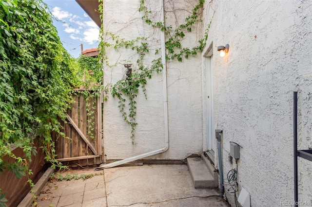 2620 S Federal Blvd Unit K, Denver, CO 80219 - view of property exterior with stucco siding and a gate