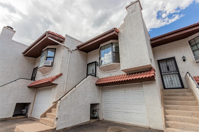2620 S Federal Blvd Unit K, Denver, CO 80219 - view of building exterior with a garage and cooling unit