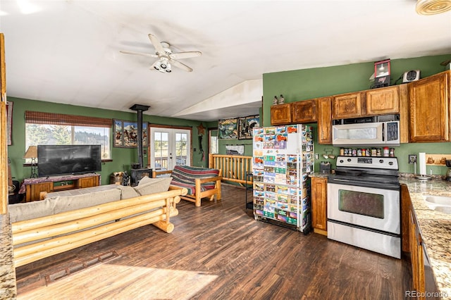 kitchen featuring ceiling fan, white appliances, dark wood-type flooring, lofted ceiling, and french doors