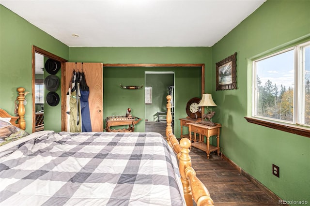 bedroom with wood-type flooring and a closet