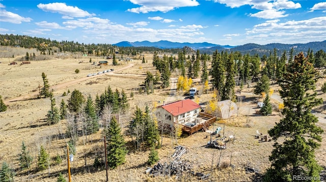 birds eye view of property with a mountain view