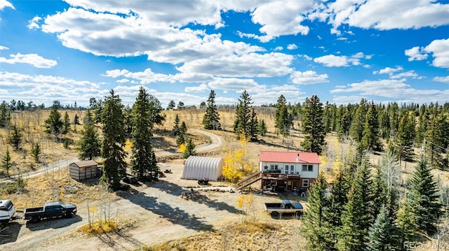 birds eye view of property with a rural view