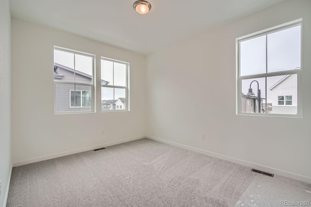 unfurnished room with carpet flooring