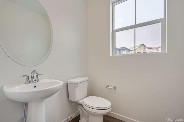 bathroom featuring toilet and sink