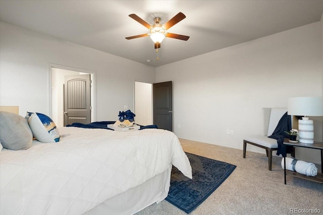 bedroom featuring ceiling fan and carpet