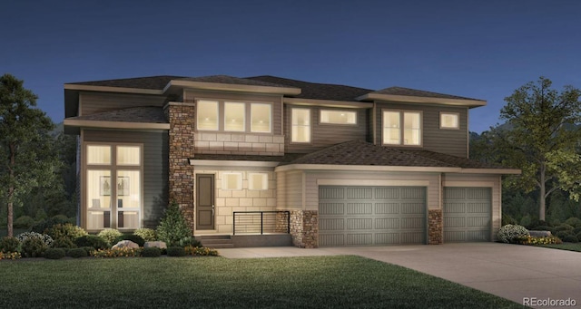 prairie-style house featuring a garage and a front yard