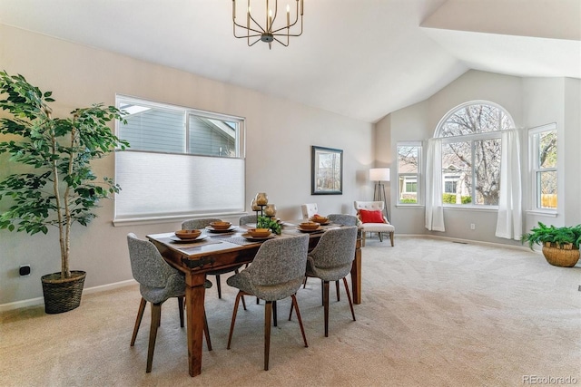 10470 W Cooper Pl, Littleton, CO 80127 - dining area featuring light carpet, baseboards, lofted ceiling, and a chandelier
