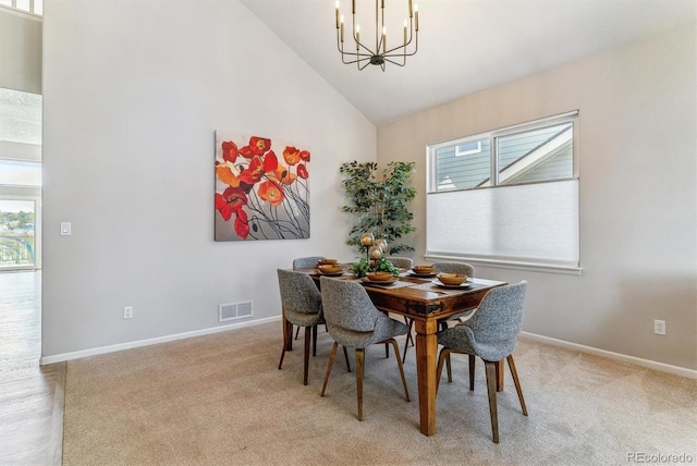 10470 W Cooper Pl, Littleton, CO 80127 - dining room featuring a chandelier, plenty of natural light, high vaulted ceiling, baseboards, and light carpet