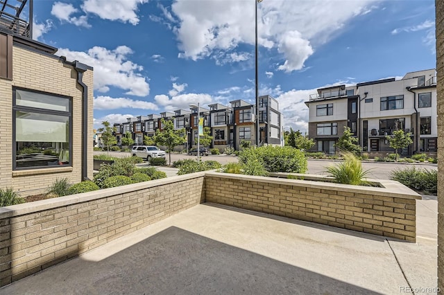 6849 E Lowry Blvd, Denver, CO 80230 - view of property's community featuring a patio area and a residential view