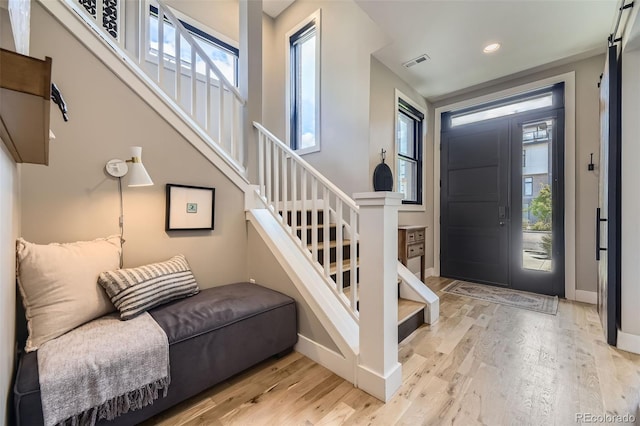 6849 E Lowry Blvd, Denver, CO 80230 - foyer with stairway, plenty of natural light, wood finished floors, baseboards, and recessed lighting