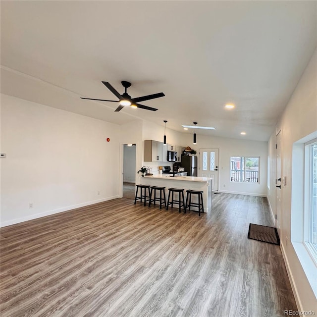 7200 E State Highway 14 Unit 27, Fort Collins, CO 80524 - living room featuring wood finished floors, baseboards, and a ceiling fan