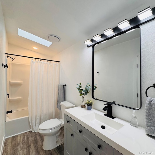 7200 E State Highway 14 Unit 27, Fort Collins, CO 80524 - bathroom featuring wood finished floors, a skylight, vanity, toilet, and shower / bath combination with curtain