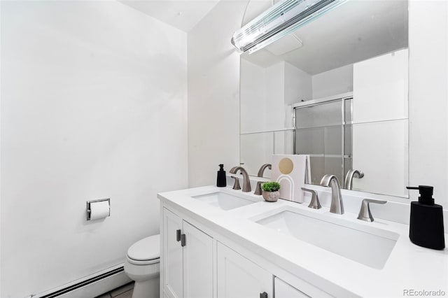 bathroom featuring vanity, toilet, walk in shower, and a baseboard heating unit