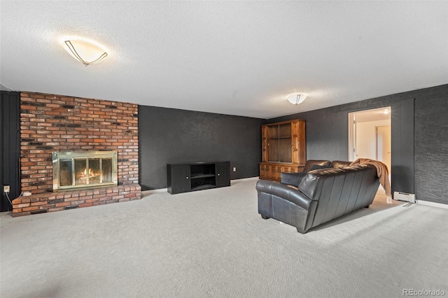 carpeted living room featuring a baseboard heating unit, a textured ceiling, and a brick fireplace