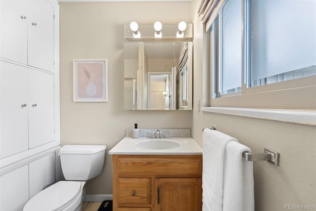 bathroom with vanity and toilet