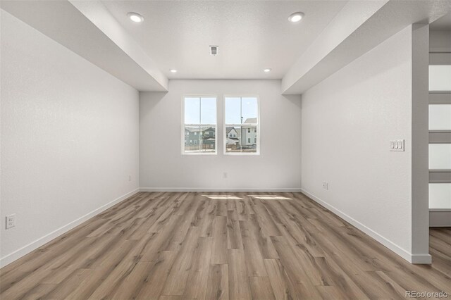2887 E 103rd Dr, Thornton, CO 80229 - additional living space featuring light wood finished floors, baseboards, and recessed lighting