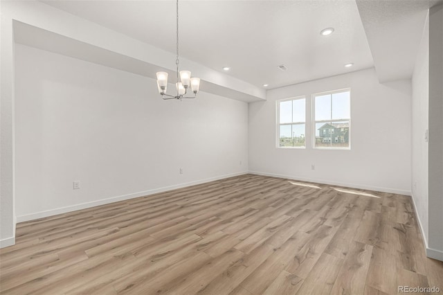 2887 E 103rd Dr, Thornton, CO 80229 - unfurnished room featuring baseboards, light wood-type flooring, a chandelier, and recessed lighting