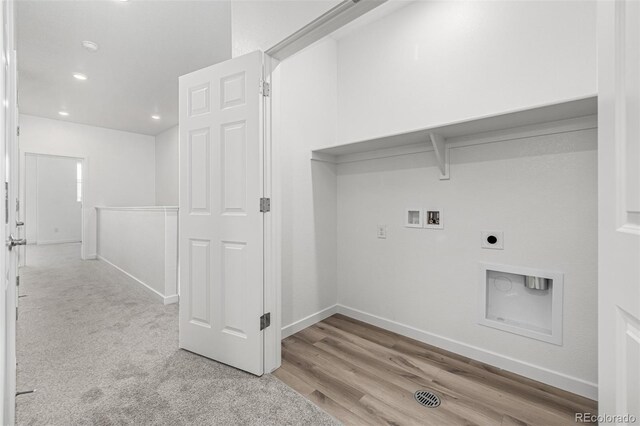 2887 E 103rd Dr, Thornton, CO 80229 - washroom with hookup for an electric dryer, hookup for a washing machine, baseboards, recessed lighting, and wood finished floors
